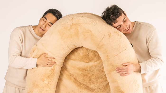 Two recent college grads create a human dog bed that goes viral on TikTok