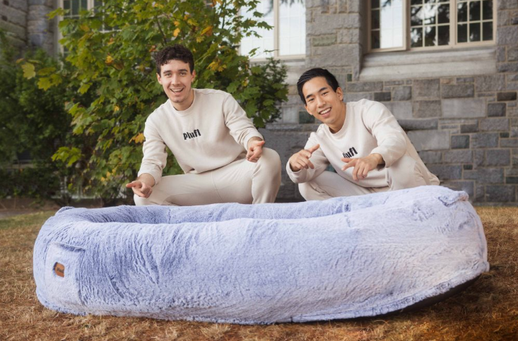 Two recent college grads create a human dog bed that goes viral on TikTok